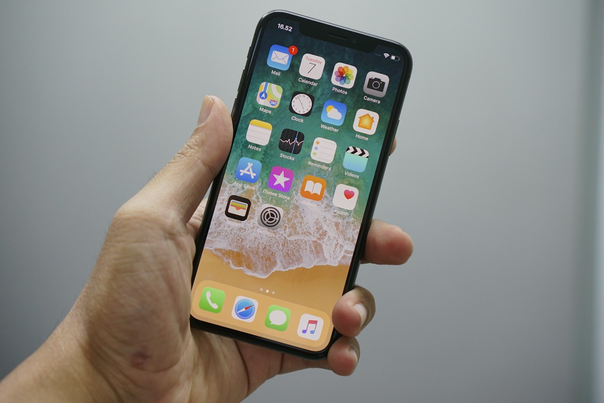 A real iPhone showing its Home Screen app icons